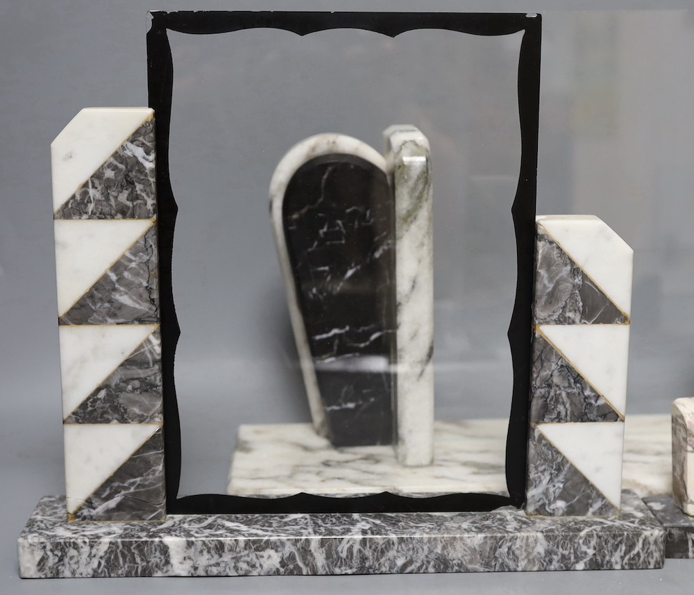 Four various Deco style marble picture frames, largest width 38cm, height 27cm